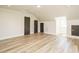 Spacious bedroom featuring wood floors, three storage closets, and white walls at 316 Barbour St, Clayton, NC 27520