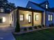 Exterior shot of covered porch with lighting fixture at dusk at 316 Barbour St, Clayton, NC 27520