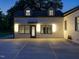Exterior shot of rear facade with new lighting fixtures at dusk at 316 Barbour St, Clayton, NC 27520