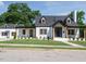 Stunning two-story home featuring a manicured lawn and modern black-and-white design elements at 316 Barbour St, Clayton, NC 27520