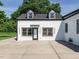 Exterior shot of updated rear facade with black trim and dormer windows at 316 Barbour St, Clayton, NC 27520