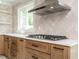 Kitchen with light countertops, modern fixtures, sleek appliances, and bright window views at 316 Barbour St, Clayton, NC 27520