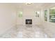 Bright living room featuring a fireplace, recessed lighting, and large windows for natural light at 316 Barbour St, Clayton, NC 27520