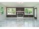 Bright living room with fireplace, large windows, and marble flooring at 316 Barbour St, Clayton, NC 27520