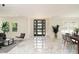Bright living room features marble floors, modern furnishings, and natural light from large windows at 316 Barbour St, Clayton, NC 27520