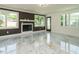Bright living room featuring a fireplace, large windows, and marble floors at 316 Barbour St, Clayton, NC 27520