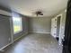 Spacious bedroom with tile floors, ceiling fan, and natural light at 317 Brewer Rd, Louisburg, NC 27549