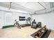 Spacious basement featuring white painted brick walls and a concrete floor at 3210 Merriman Ave, Raleigh, NC 27607