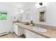 Bright bathroom features double sinks with a granite countertop and vanity area at 3210 Merriman Ave, Raleigh, NC 27607