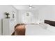 Bright bedroom with ceiling fan, hardwood floors, and white trim, plus built-in storage at 3210 Merriman Ave, Raleigh, NC 27607
