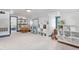 Spacious bonus room with built-in bookshelves, a play kitchen, and a whimsical collection of toys and books at 3210 Merriman Ave, Raleigh, NC 27607