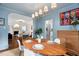 Stylish dining room with a wooden table and view into the living room at 3210 Merriman Ave, Raleigh, NC 27607