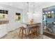 Kitchen bar with granite countertops, pendant lighting, and wicker stools near dining area at 3210 Merriman Ave, Raleigh, NC 27607