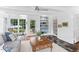 Bright sunroom featuring large windows, comfortable seating, and a view to the outdoors at 3210 Merriman Ave, Raleigh, NC 27607