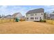 Large backyard with play set, patio, and privacy fence surrounding yard at 329 Royal Delta Dr, Cary, NC 27519