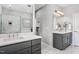 Bright bathroom with dual sink vanity, framed mirrors, walk-in shower, and ample storage space at 329 Royal Delta Dr, Cary, NC 27519