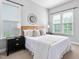 Comfortable bedroom featuring a wooden headboard bed with black nightstands and modern decor at 329 Royal Delta Dr, Cary, NC 27519