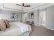 Spacious bedroom with tray ceiling, a comfortable bed, and a cozy seating area for relaxation at 329 Royal Delta Dr, Cary, NC 27519