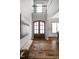 Grand foyer with high ceilings, hardwood floors, a bench, and large windows for natural light at 329 Royal Delta Dr, Cary, NC 27519