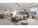 This luxurious main bedroom boasts a comfortable seating area, plush furnishings and decor, and lots of natural light at 329 Royal Delta Dr, Cary, NC 27519