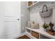 Functional mudroom area with built-in bench, coat hooks, and storage baskets for organization at 329 Royal Delta Dr, Cary, NC 27519