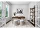 Cozy home office featuring a wooden desk, stylish stools, and an elegant bookshelf at 329 Royal Delta Dr, Cary, NC 27519