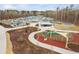 Community playground featuring walking trail, playground equipment, and recreational space at 329 Royal Delta Dr, Cary, NC 27519