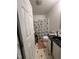 Compact bathroom features patterned shower curtain, tiled floors, and a vanity, designed for efficiency and convenience at 333 Park Ave, Rocky Mount, NC 27801