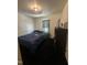 Simple bedroom features a bed, a dark dresser, and a window, creating a private and calm space at 333 Park Ave, Rocky Mount, NC 27801