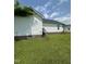 Exterior view of the house with a well-maintained backyard, showing a small deck at 333 Park Ave, Rocky Mount, NC 27801