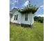 Exterior view showcasing the side of the house and the lush greenery at 333 Park Ave, Rocky Mount, NC 27801