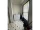 Practical laundry area with a deep freezer, a black curtained window, and patterned flooring, maximizing utility at 333 Park Ave, Rocky Mount, NC 27801