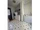 Bright laundry room with side-by-side washer and dryer, featuring tiled floors and ample space for storage at 333 Park Ave, Rocky Mount, NC 27801