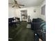 A cozy living room view with dark sofas and an open entry to the kitchen, creating an inviting space at 333 Park Ave, Rocky Mount, NC 27801