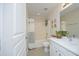 Bright bathroom features a sink with vanity and a bathtub and shower with curtain at 365 Red Elm Dr, Durham, NC 27713