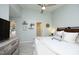 Comfortable bedroom with a neutral palette, ceiling fan, and decorative shelving for a cozy ambiance at 365 Red Elm Dr, Durham, NC 27713