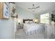 Stylishly decorated bedroom featuring a ceiling fan, plush carpet, and ample natural light at 365 Red Elm Dr, Durham, NC 27713