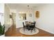 Cozy dining area featuring a round table, hardwood floors, and an open layout at 365 Red Elm Dr, Durham, NC 27713