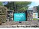 Community YMCA sign with stone base, near trees, offering recreation to residents at 365 Red Elm Dr, Durham, NC 27713