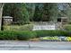 Welcoming community sign surrounded by meticulously maintained landscaping, creating a serene atmosphere at 365 Red Elm Dr, Durham, NC 27713