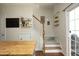 Bright entryway with staircase, wood floors, and stylish décor, leading to the upper level at 365 Red Elm Dr, Durham, NC 27713