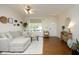 Bright living room with hardwood floors, a comfortable sofa, and stylish decor at 365 Red Elm Dr, Durham, NC 27713