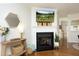 Inviting living room with a fireplace, hardwood floors, and stylish decor at 365 Red Elm Dr, Durham, NC 27713