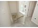 Neutral staircase with carpet runners leads upstairs, showcasing a clean and inviting transition at 365 Red Elm Dr, Durham, NC 27713