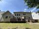 Spacious backyard featuring a deck, patio, and fenced yard at 3713 Coach Lantern Ave Ave, Wake Forest, NC 27587