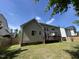 Backyard featuring a deck, partial fencing, and green grass at 3713 Coach Lantern Ave Ave, Wake Forest, NC 27587