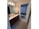 Bathroom with a vanity and mirror; the image looks into the closet and the shower at 3713 Coach Lantern Ave Ave, Wake Forest, NC 27587