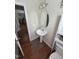 Bright powder room featuring an oval mirror and pedestal sink at 3713 Coach Lantern Ave Ave, Wake Forest, NC 27587