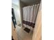 Bathroom shower with curtain and a partial view of the toilet and window at 3713 Coach Lantern Ave Ave, Wake Forest, NC 27587