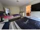 Bright bedroom with a bathroom view featuring neutral walls and two beds at 3713 Coach Lantern Ave Ave, Wake Forest, NC 27587